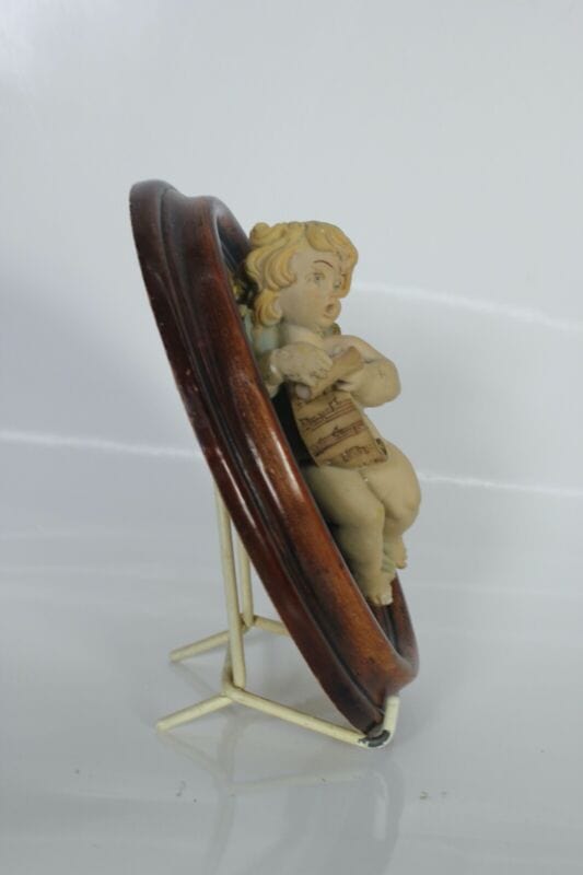 Angelo decorativo stile antico putto da parete con cornice ovale cherubino Quadri