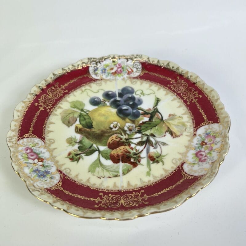 Piatto decorativo vintage in porcellana Cuzzi da parete – La Primula Rossa  Antiquariato